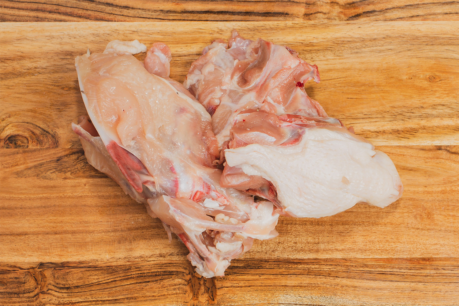 Raw feeding through nutritious chicken frames, providing essential proteins and bone content for your dog's healthy diet.